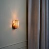 Handcrafted Costa Wall Lamp Mini Rattan Brass with natural rattan cylindrical shade.