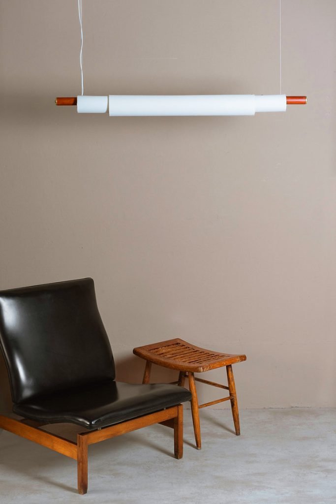 Handmade pendant lamp with white fabric shade, teak wood, and brass details