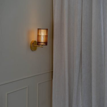 Handcrafted SUA Wall Sconce Lamp S with MDF wood slats and brass, featuring dual shades for warm light.