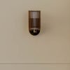 Handcrafted SUA Wall Sconce Lamp S with MDF wood slats and brass, featuring dual shades for warm light.