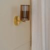 Handcrafted SUA Wall Sconce Lamp S with MDF wood slats and brass, featuring dual shades for warm light.