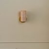 Handcrafted Costa Wall Lamp Mini Rattan Brass with natural rattan cylindrical shade.