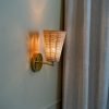 Handcrafted Costa Wall Lamp Cone Rattan/Brass with a natural rattan cone shade and brass accents.