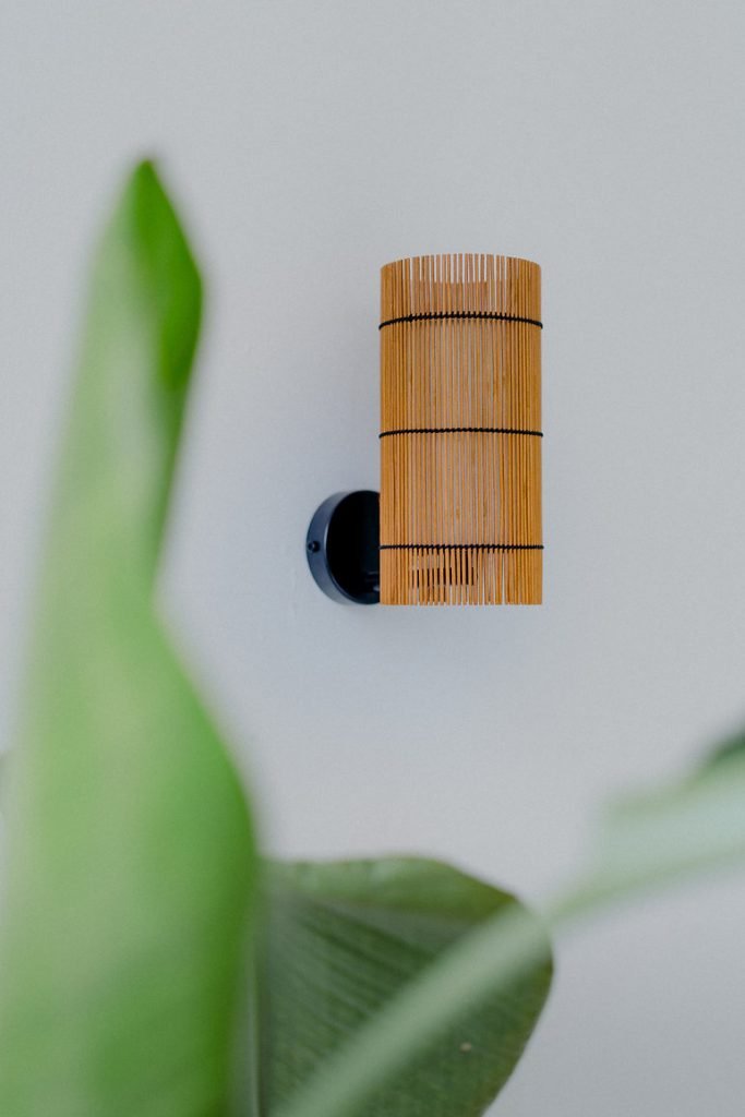 Handmade FOC Wall Lamp in cherry bamboo with black thread, featuring a white interior shade for warm light.