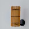 Handmade FOC Wall Lamp in cherry bamboo with black thread, featuring a white interior shade for warm light.