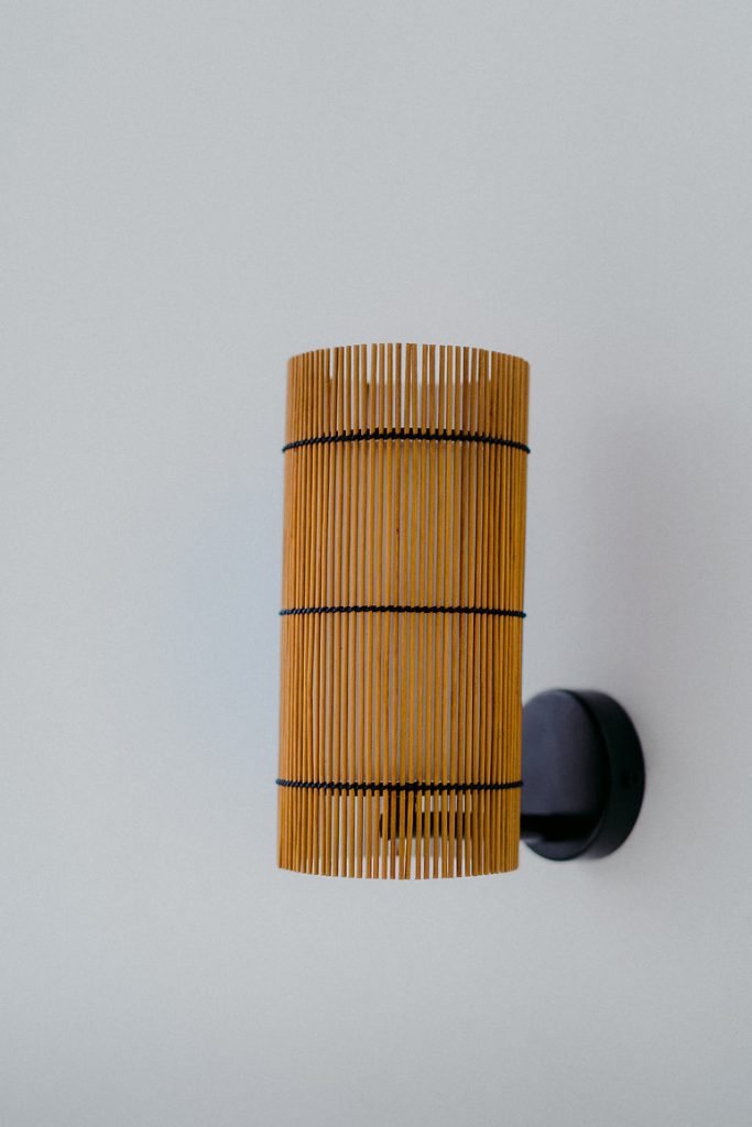 Handmade FOC Wall Lamp in cherry bamboo with black thread, featuring a white interior shade for warm light.